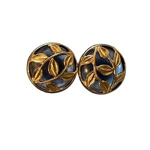 Gold toned leaf overlay, blue underside, pierced earrings.